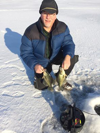 image of Bob Behrner with Crappies on the ice