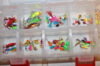 image of tackle box filled with ice fishing lures and jigs