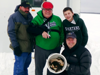 image of ice fishermen with pail full of fish