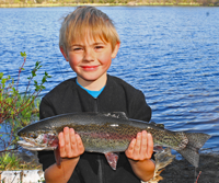 image of jordan tew with beautiful Rainbow Trout