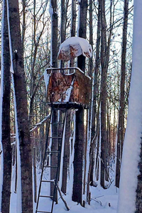 image of snow covered deer stand