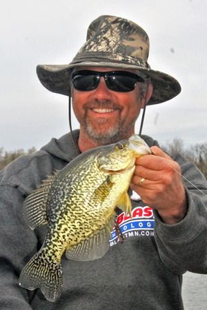 image of fisherman with crappie